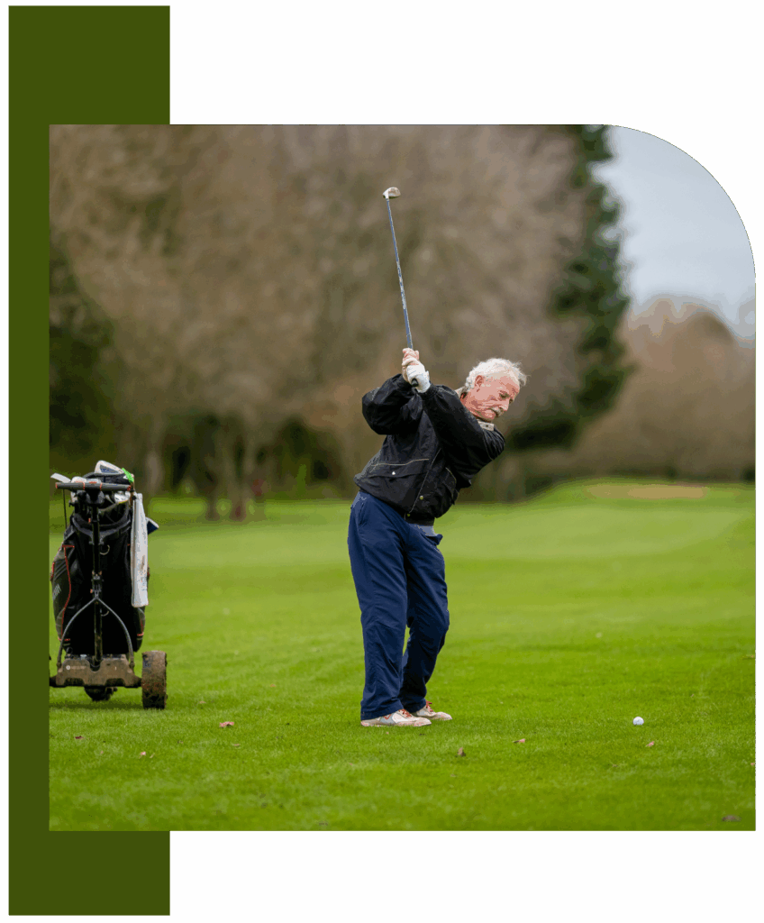 Older Male Golfer Practicing Swing